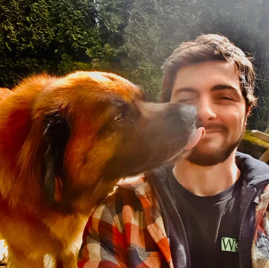 Conor Ryan, owner of Shea Plumbing, with a dog